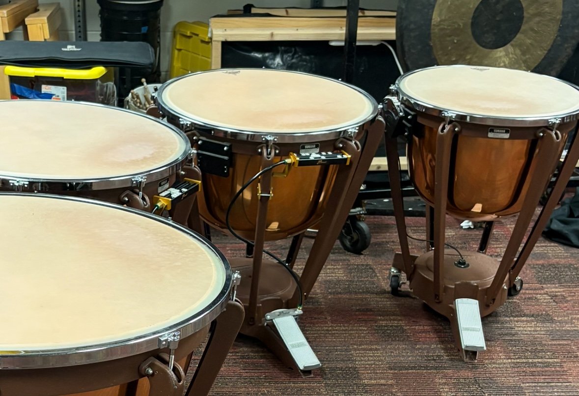 Worn timpani head showing damage at the playing spot